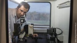 Image: A man working with a 3D printer; Copyright: Patrick Mansell/Penn State 